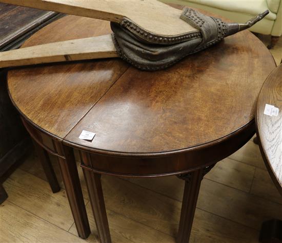 A pair of George III mahogany demi lune side tables, W.3ft 6in. D.1ft 8in. H.2ft 4in.